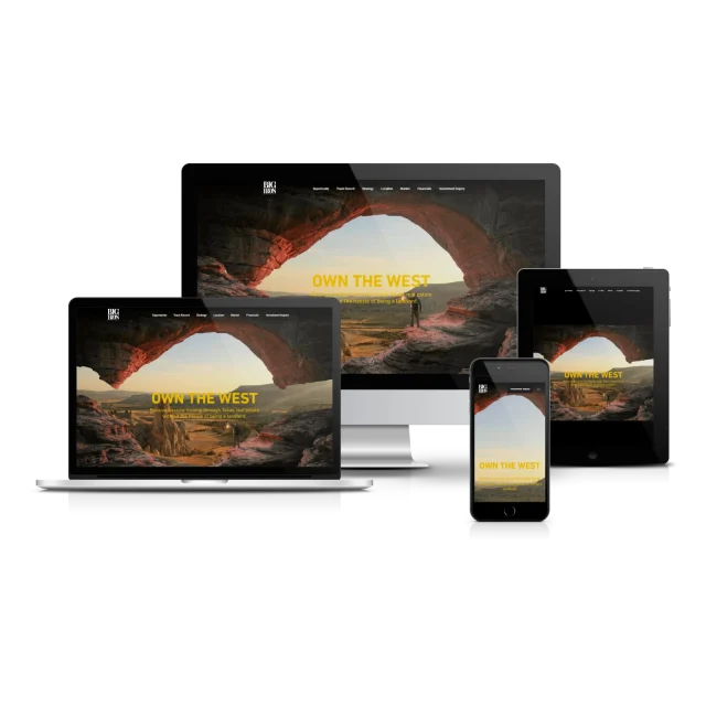 Responsive website mockup displaying 'Own The West' design across laptop, desktop monitor, tablet, and smartphone screens